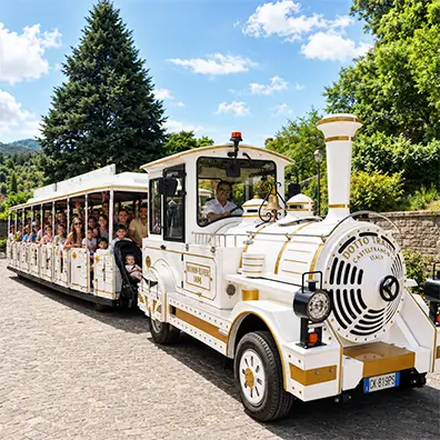 The eco-friendly Mercurio Train in a historic town centre